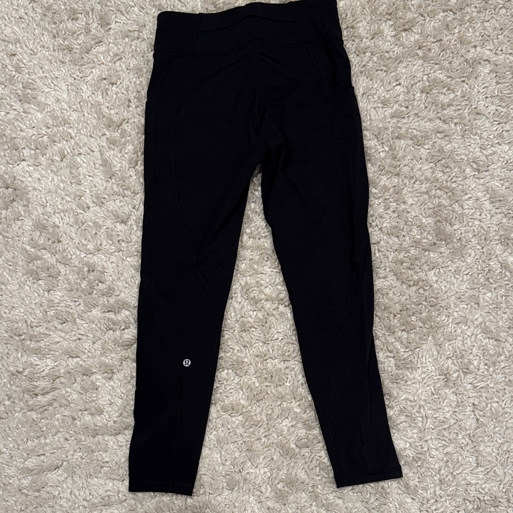 Black running leggings size 8, side pockets, black pockets for keys, compression